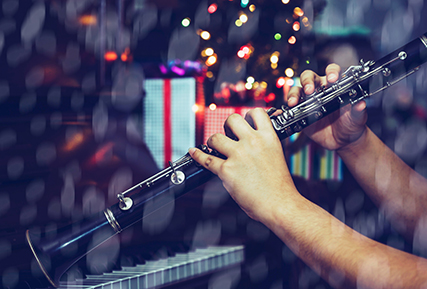 person playing a clarinet.