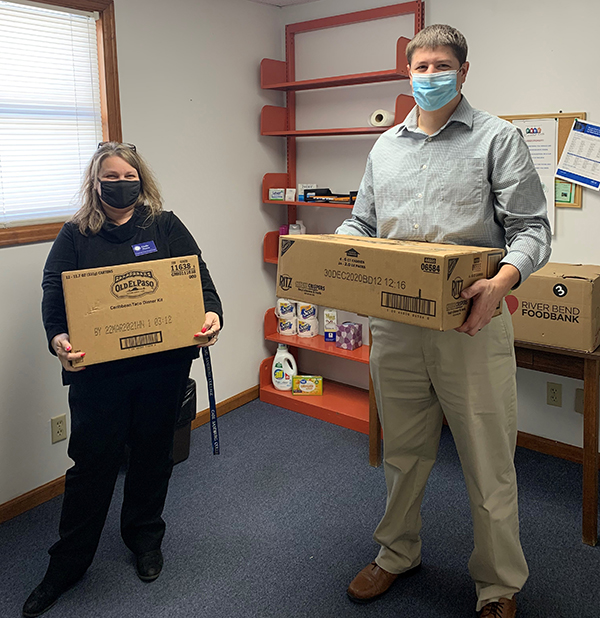 Linda Thomas and Cory Gall with boxes for Branch Campus Resource Room