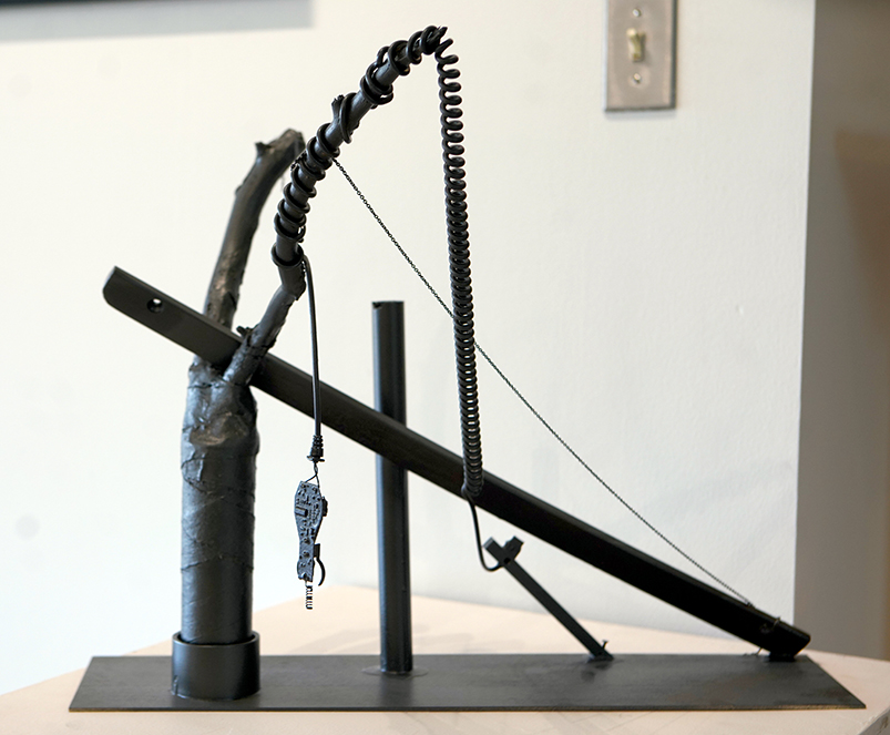 electro sculpture, created with found objects, springs, sticks, wire.