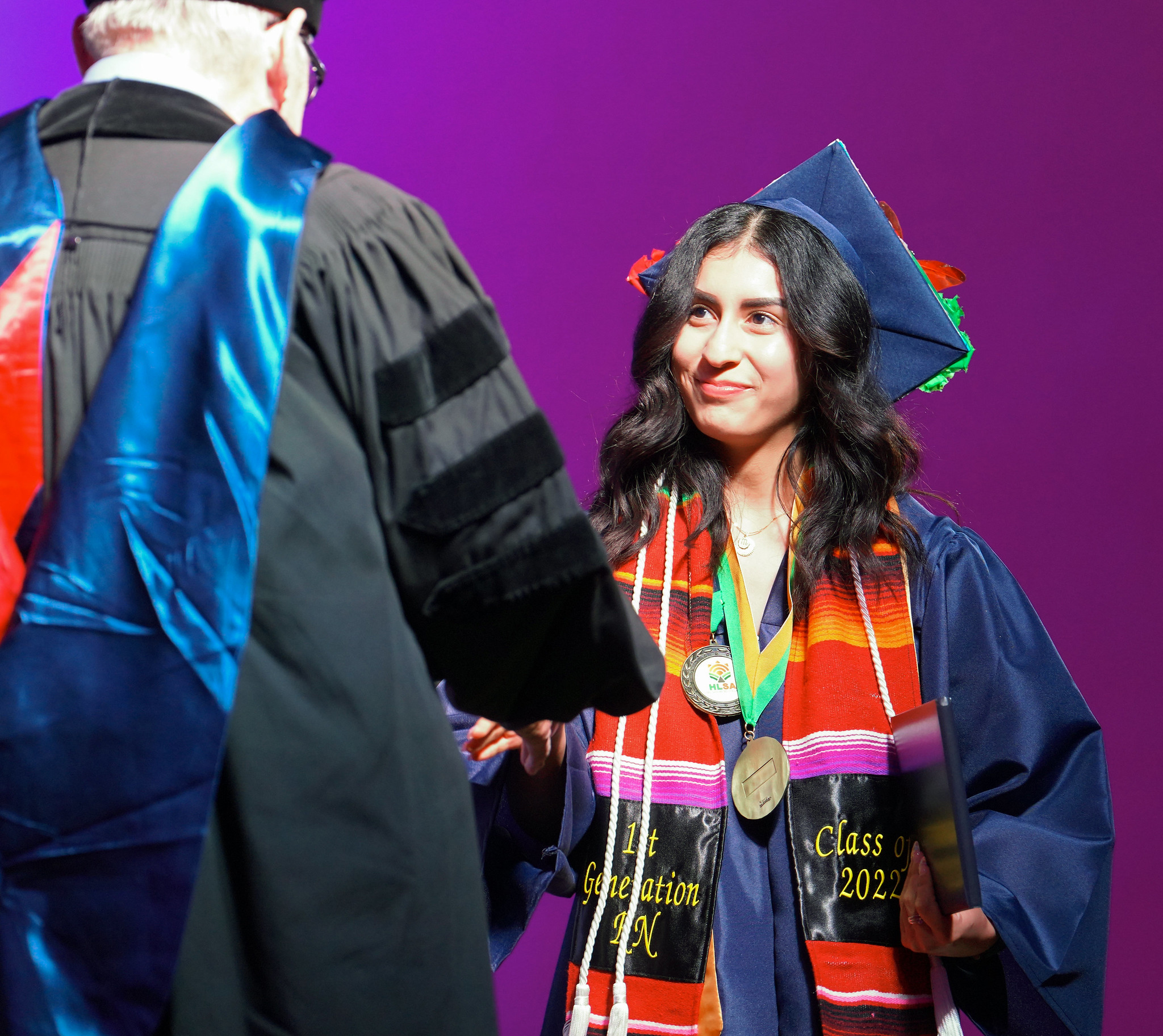 Selina Godina receiving diploma