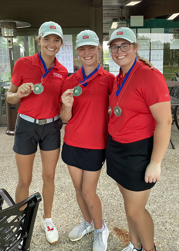 Averi Heintzelman, Anna Duden and Olivia Schwingle with medals