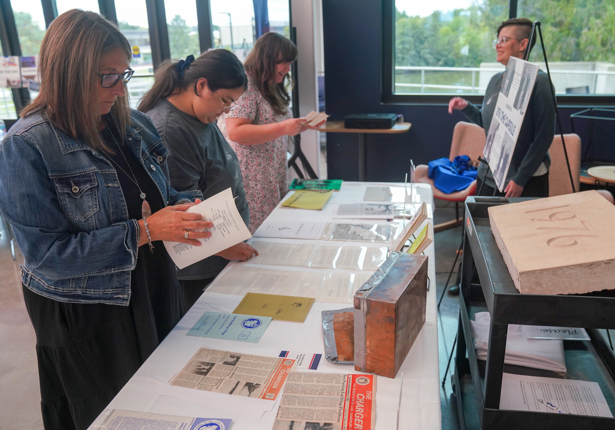 Founders Day attendees looking at items from time capsule