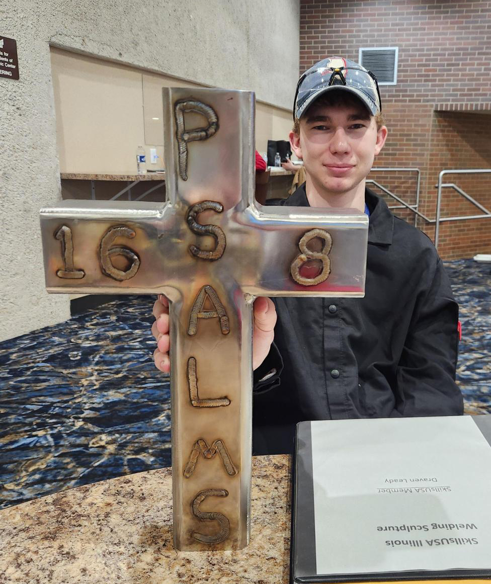 Draven Leady with welding sculpture.