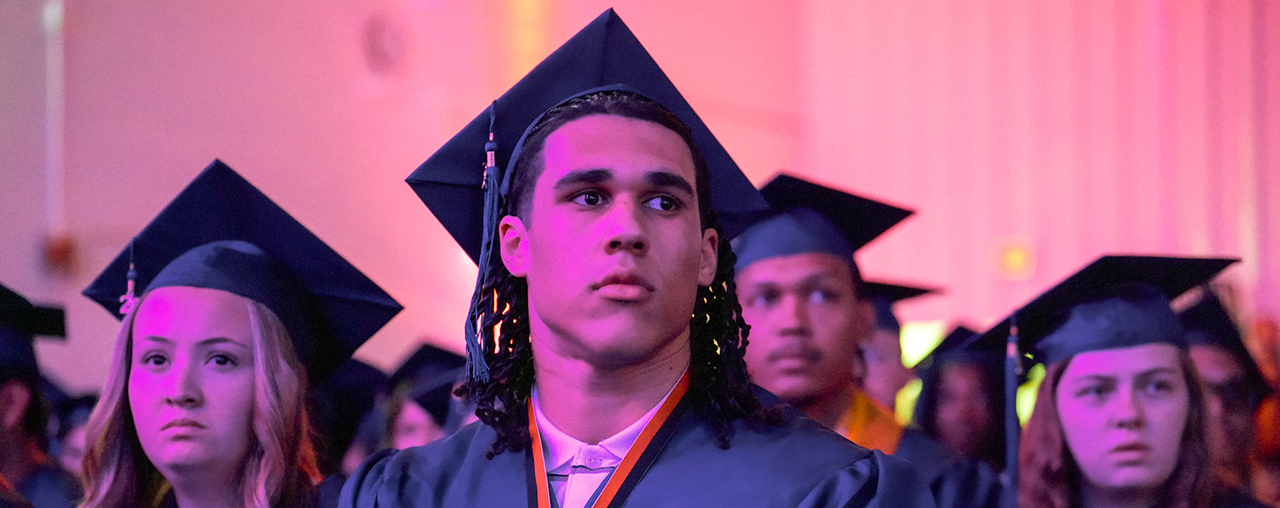 Students sitting in graduation.