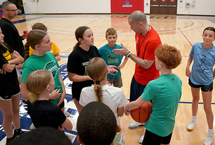 Kids playing basketball.