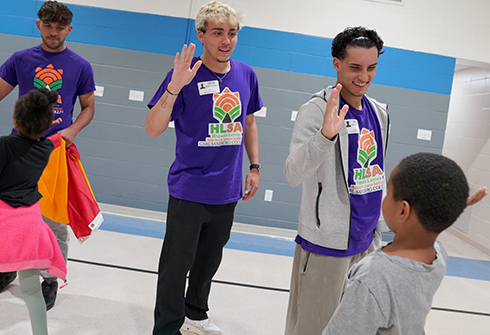 HLSA members high-fiving Steele Elementary students.