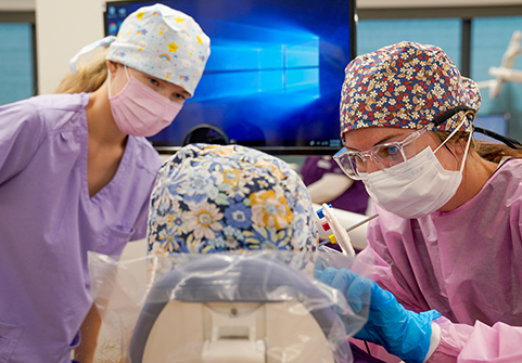 Dental hygiene students with patient.