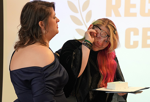 Keri McKay cries while receiving 2025 Spirit of Sandburg Award.