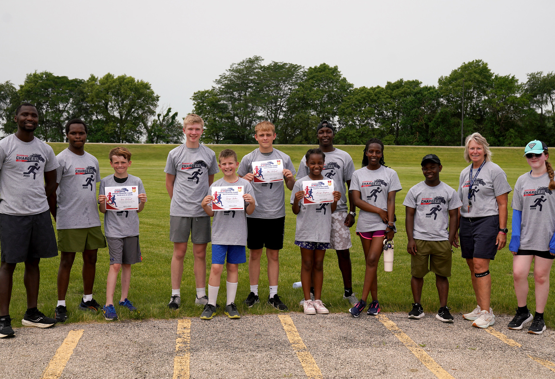 Group photo of cross country camp participants and Chargers runners.