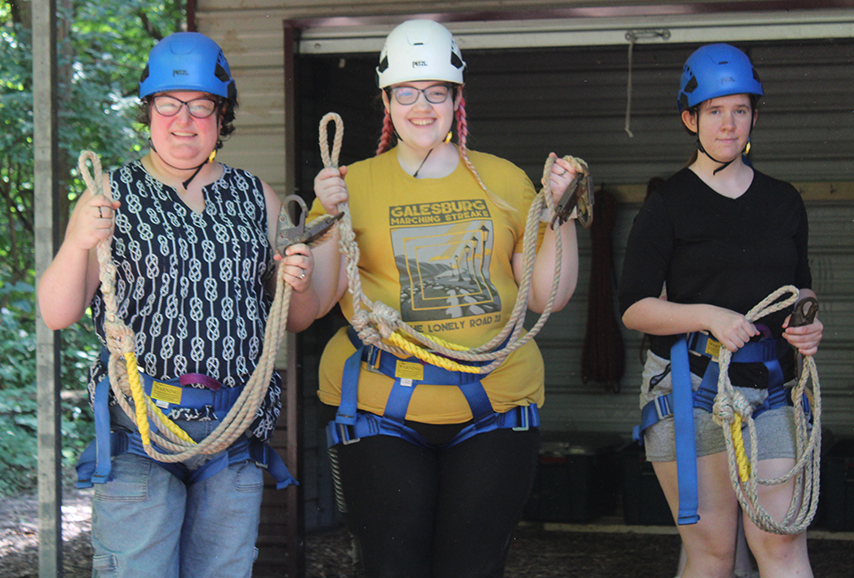 three women in climbing gear.