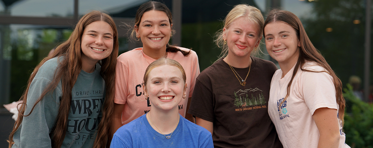 group of women smiling at the camera.