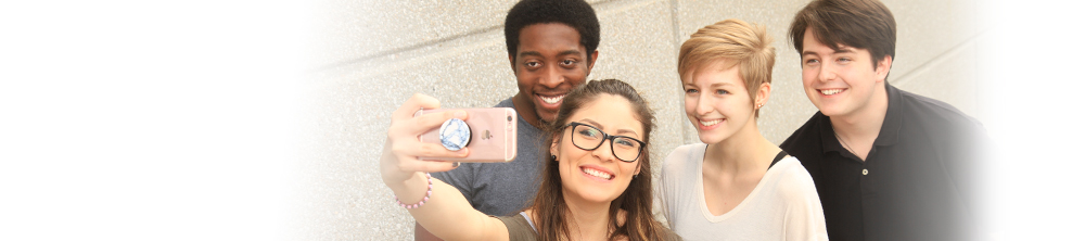 students taking selfie 