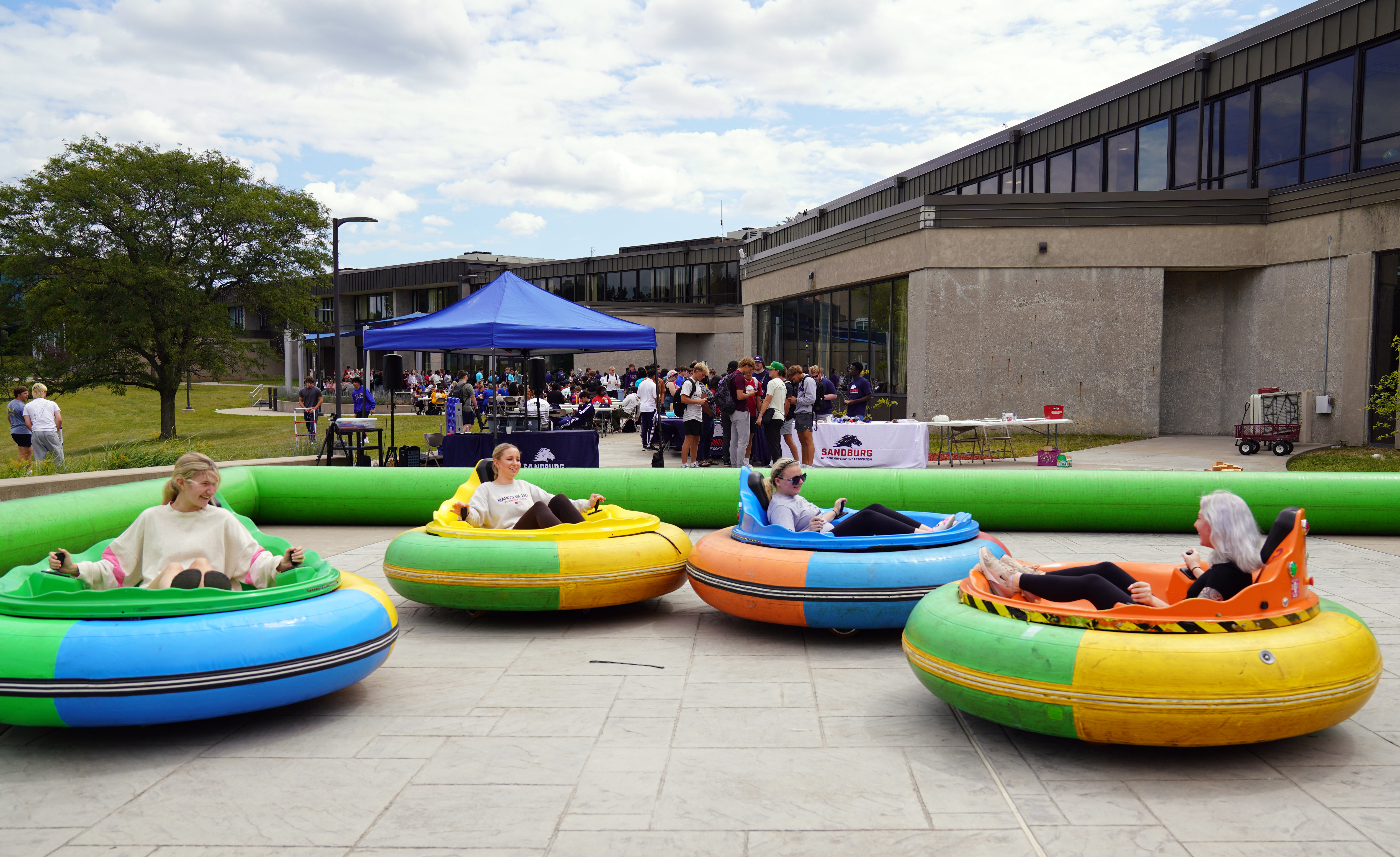 Students riding bumper cars at Fall Fest