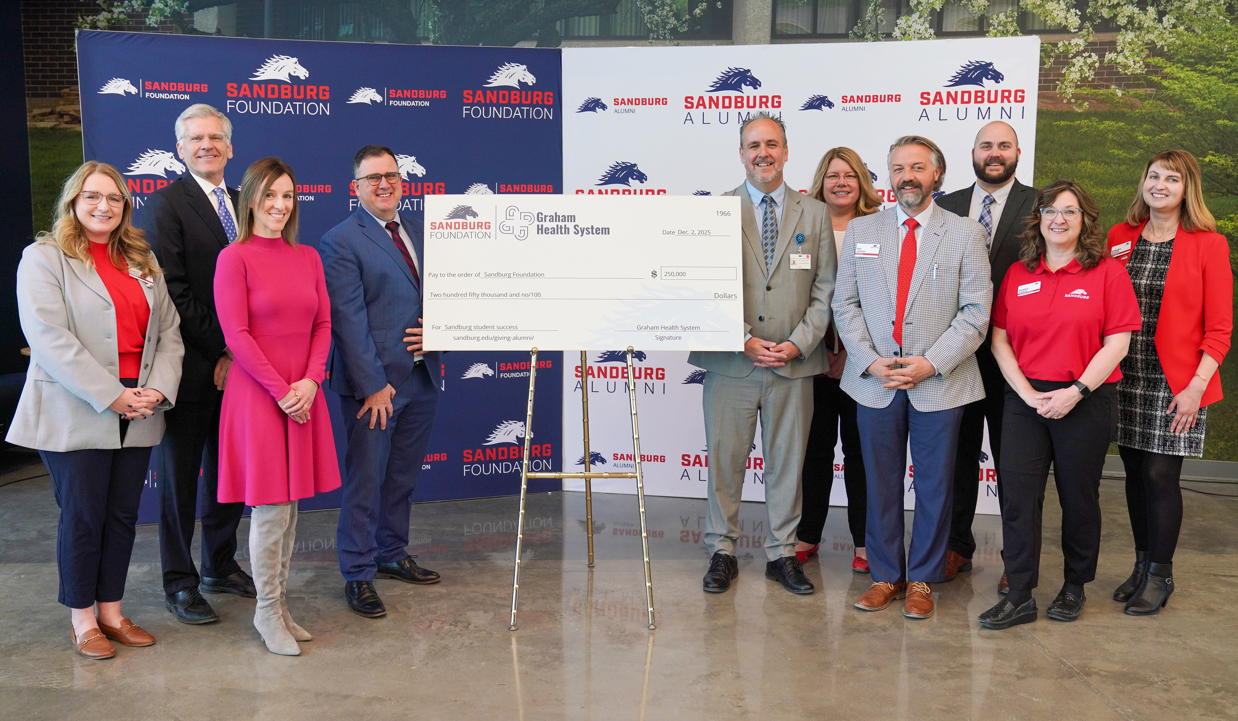 Ceremonial check passing for naming of Graham Health System Science & Technology Center Atrium