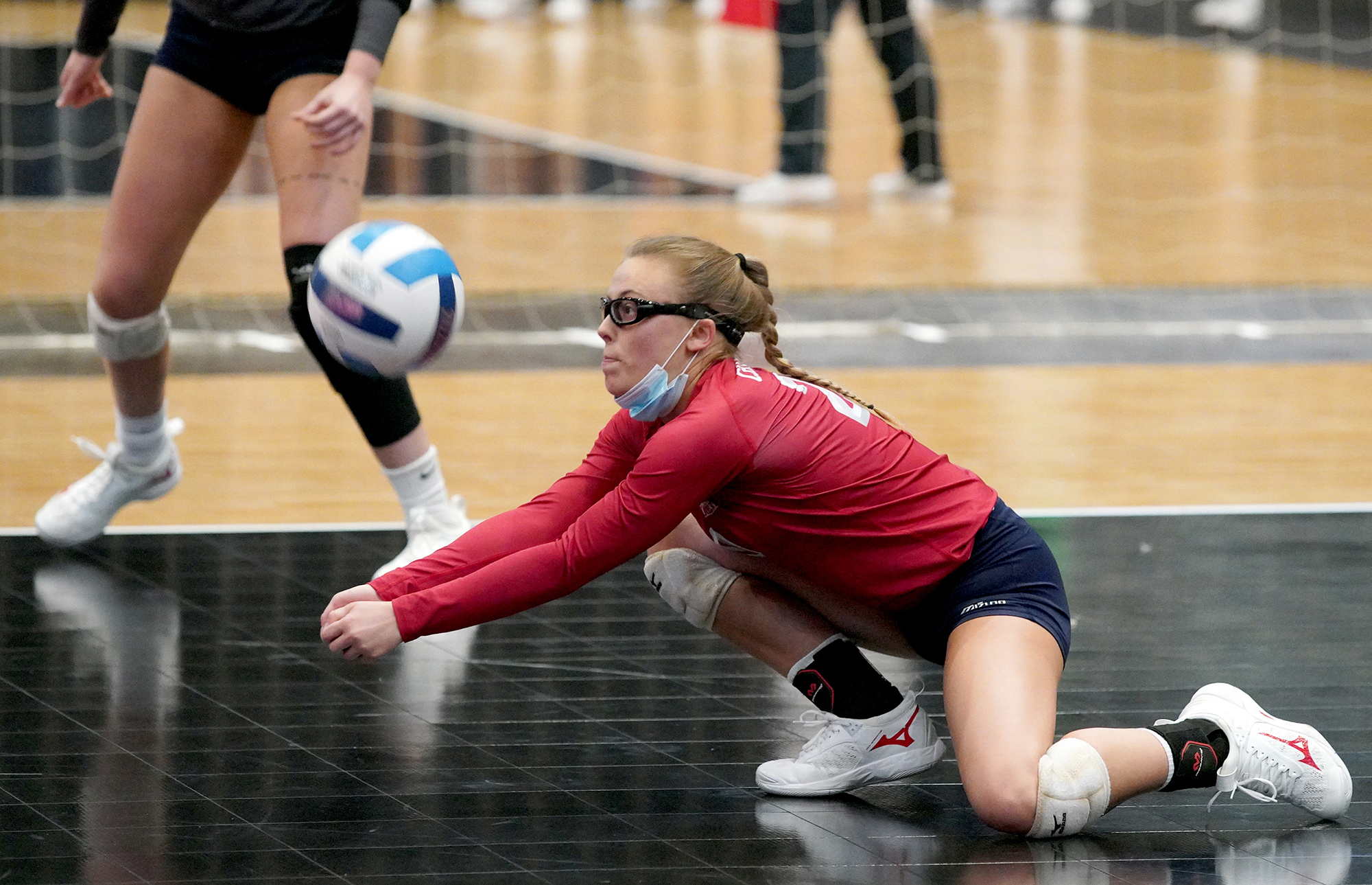 Volleyball player digging ball